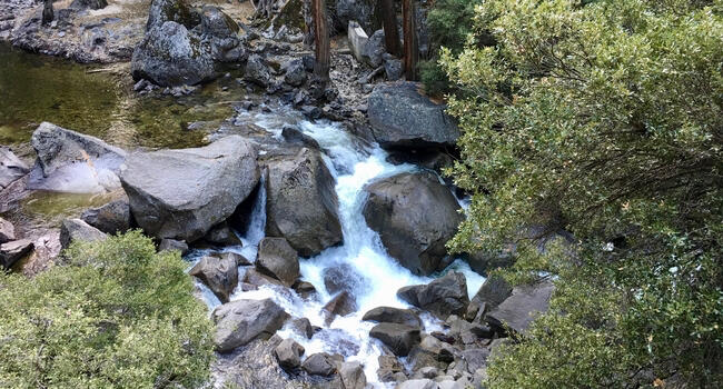 Water flowing over granite rocks.